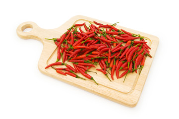 Pepper and cutting board isolated on the white