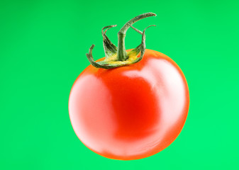 Red tomato against gradient background