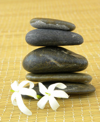Fototapeta na wymiar Spa. Cairn stones with jasmine