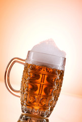 Beer glasses against the colorful gradient background