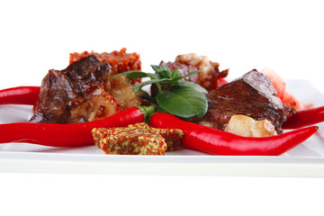 roast meat chunks on white plate
