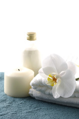 Fototapeta na wymiar spa and wellness massage oil and flowers with candles