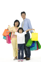Happy family shopping. Isolated over white
