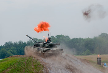 T-80 tank driving through explosion
