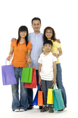 Happy family shopping on white