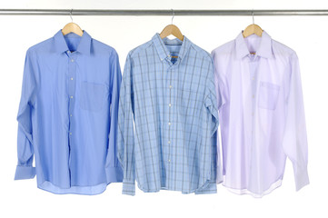 Close-up of three blue shirts