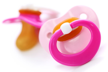 Two pink dummies isolated on white background