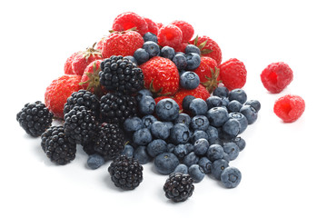 Fresh forest berries on white background