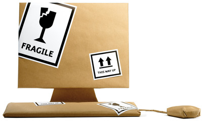 computer wrapped up in brown paper