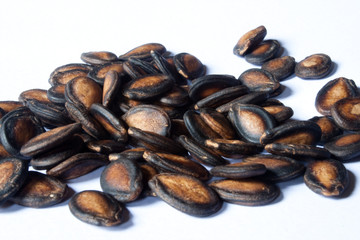 Black Melon Seeds on white background