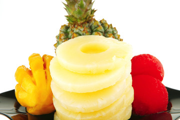 raw fruits on black plate