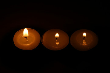 three burning candles