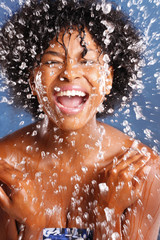 Fototapeta na wymiar Cute African American splashes water to clean her face