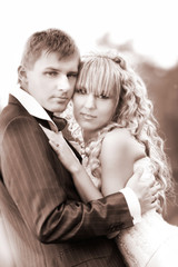Fototapeta na wymiar young loving couple on their weddng day