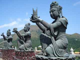 Obraz premium Buddhist statues making offerings, Lantau Island