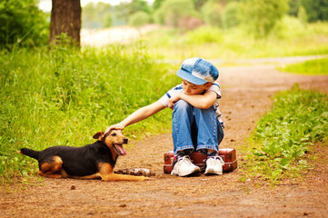 The boy with his dog in the forest