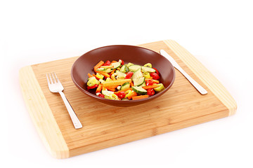 Vegetables mix in plate with knife and fork