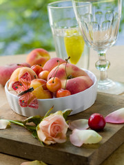 Fresh fruits in bowl with butterfly