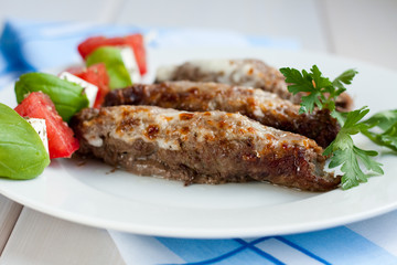 Roasted stuffed pork rolls