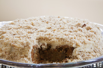 Delicious Carrot and Walnut Cake with a Piece Taken Out