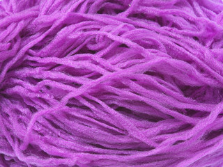 Closeup photo of violet synthetic yarn