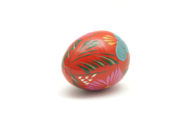 Wooden painted Easter egg isolated on white