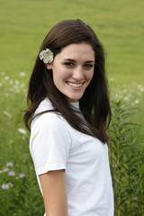 Young woman with flower in hair