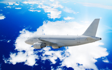 Aircraft above cumulus clouds