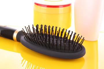 Big black comb on yellow background