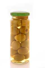Pickled olives in glass jar on white