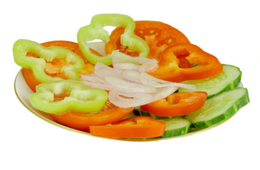 tomato, sweet pepper, cucumber and onion on a plate