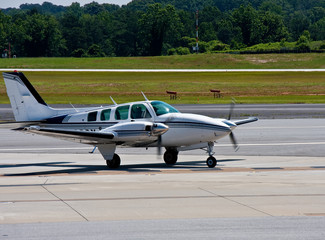 Blue and White Twin Engine Rolling In