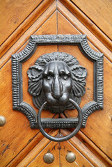 Brazen lion head door knocker
