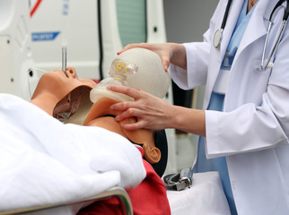 The man on a dummy trains to do Cardiopulmonary resuscitation