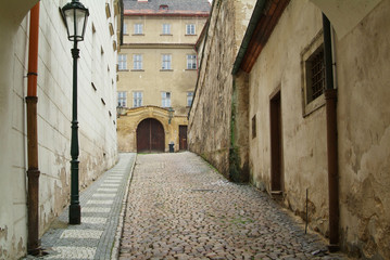 Narrow alley between tenement houses in Prague.