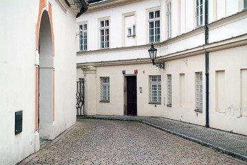 Narrow alley between tenement houses in Prague.