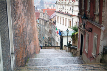 Narrow alley between tenement houses in Prague