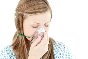 Depressed female patient with a mask