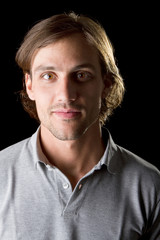 Young male model over black background