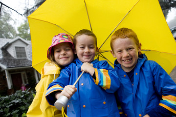 Young children playing in rain