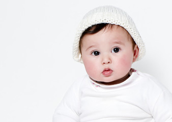 Little girl a on white background. Portrait