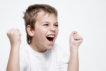 Happy boy football fan on light background