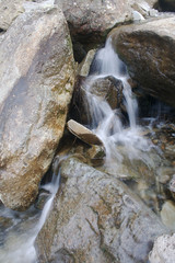 Water Pouring between the Rocks