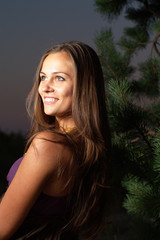 Naklejka premium Fashion model in the night forest