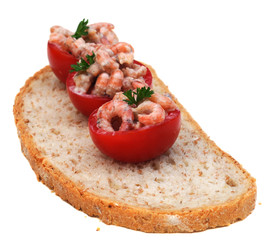 Three cocktail tomatoes with shrimps, shallow dof