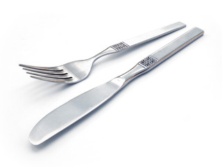 Stainless steel knife and fork on white table