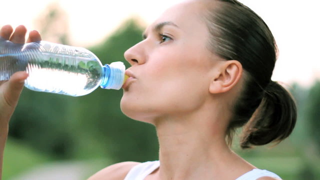 Woman drinking water after sport activities, shoot at 60fps