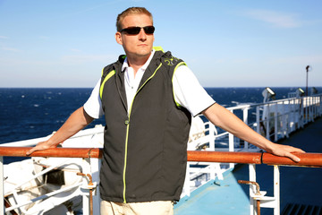 Man on ferry during cruise on vacation in Corsica, France