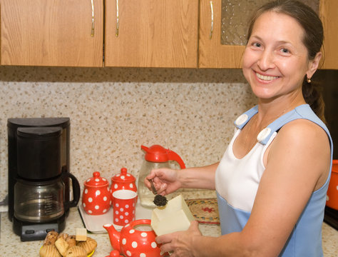 Elderly Woman Making Tea