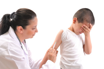 Doctor giving an injection in arm a mimmicking child.